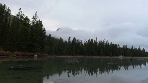 Timelapse of clouds moving across a lake in Teton National Park Stock Footage 75065135