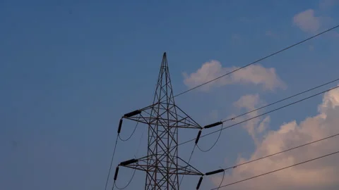 Timelapse - Clouds moving behind a electric pole 4K30 Stock Footage 268788294