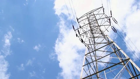 Timelapse - clouds moving behind electrical tower Stock Footage 81756626