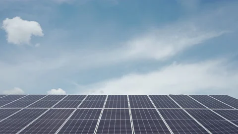 Timelapse of clouds moving in the blue sky with solar power station panels Stock Footage 155783255
