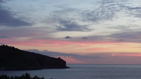 Timelapse of clouds moving on Cape Palinuro, Italy. Warm pink tones Stock Footage 93987187