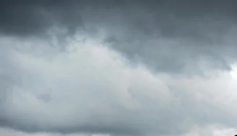 Timelapse of Clouds moving fast in a dark sky Stock Footage 317903584