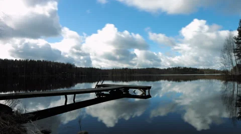 Timelapse of clouds moving on a lake and pier Stock Footage 49687919