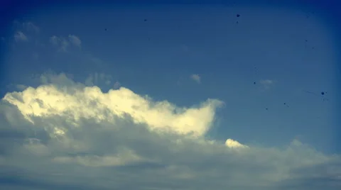 Timelapse of clouds moving from left to right. warm tones, scratches and dust. Stock Footage 68343988