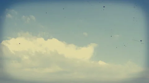 Timelapse of clouds moving from left to right. Vintage, faded colors, dust, Stock Footage 68344222