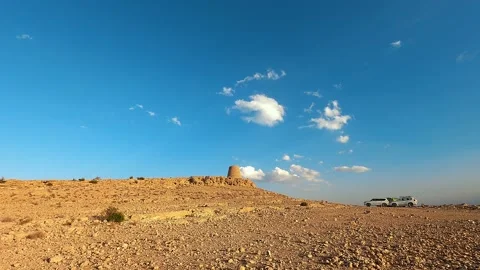 A timelapse of clouds moving over an ancient tomb on the Selma Plateau in Oman Stock Footage 238854079