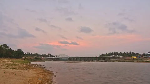 Timelapse - Clouds moving over an arch bridge during golden hour 스톡 동영상 87318796