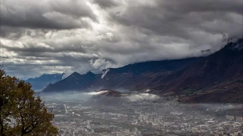 Timelapse - Clouds moving over a city Stock Footage 165683484