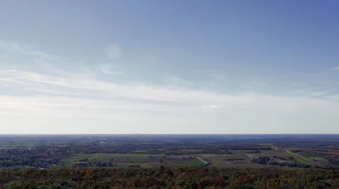Timelapse: Clouds moving over Fall farmland and treetops Stock Footage 31751663