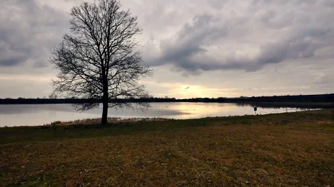 Timelapse clouds moving over the field.  Stock-Footage 73810217