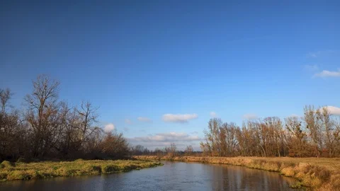 Timelapse clouds moving over the field.   Video stock 99936695