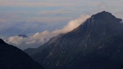 Timelapse of clouds moving over Furkapass mountain Alpine range 库存影片 123403397