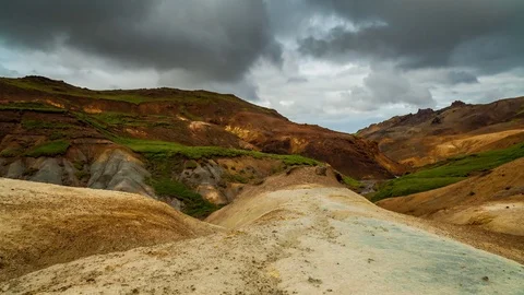 Timelapse of clouds moving over the geothermal clay canyon and mountains Stock Footage 73011103