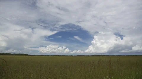 Timelapse of Clouds Moving Over Grassland 스톡 동영상 26745159