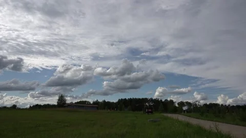 Timelapse clouds moving over the green hill Stock Footage 253665927