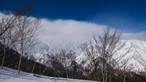 Timelapse of clouds moving over hakuba back country mountains in winter Stock-Footage 124571212