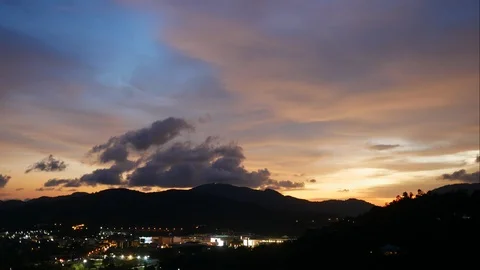 Timelapse of clouds moving over high silhouette mountains Video stock 89577425