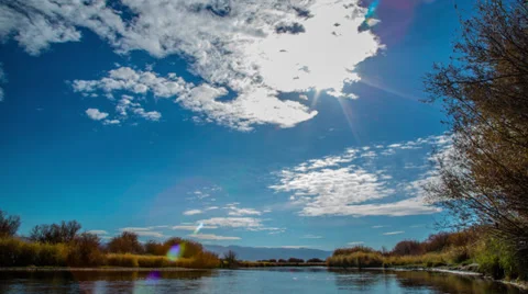 Timelapse of clouds moving over an Idaho river Stock Footage 36315356