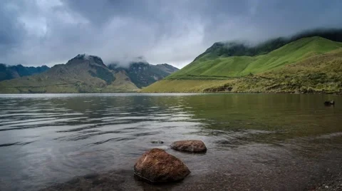 Timelapse of clouds moving over the lake Mojanda in Ecuador Video stock 46280193