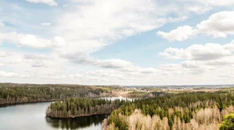 Timelapse of clouds moving over a lake and islands Stock Footage 49689360