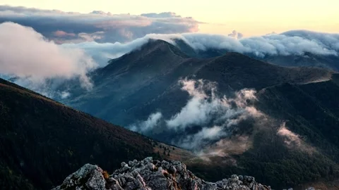 Timelapse of clouds moving over mountains, slow motion of white clouds Stock-Footage 285983762