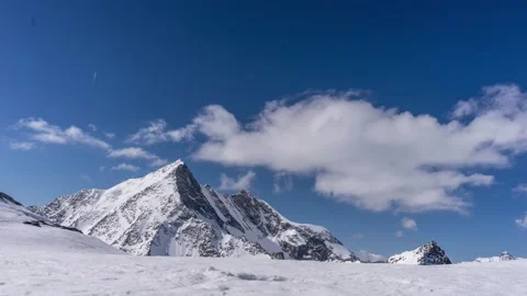 Timelapse of clouds moving over a peak in the mountains Stock Footage 165683883
