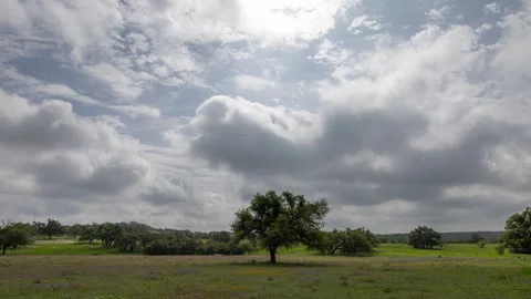 Timelapse of clouds moving over a rural landscape in central Texas - April Stock Footage 273272296
