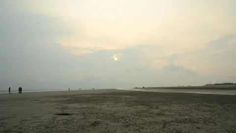 Timelapse of Clouds Moving Over Sandy Beach at Sunset Stock Footage 239170534