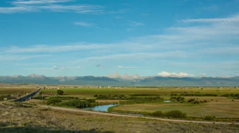 Timelapse of clouds moving over Teton Valley in Idaho as the sun sets Stock Footage 36319805