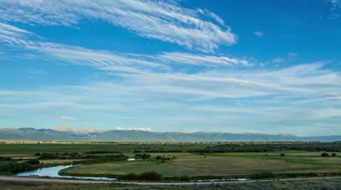 Timelapse of clouds moving over Teton Valley in Idaho as the sun sets Stock Footage 36319904