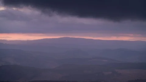 Timelapse of clouds moving over a valley at sunset from Mount Blackheath Stock Footage 114456731