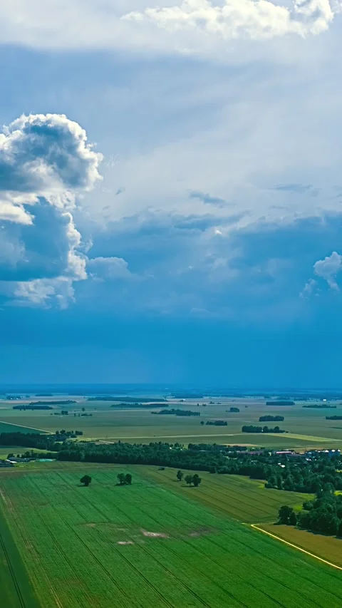 Timelapse of Clouds Moving Over Vast Farmland Fields in Latvia Stock Footage 342471645