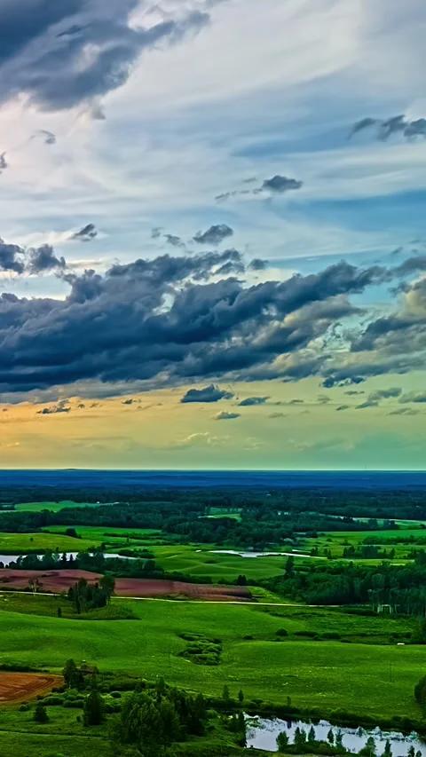 Timelapse Clouds Moving at Sunset Over Meadows Jelgava Latvia Video stock 345118019