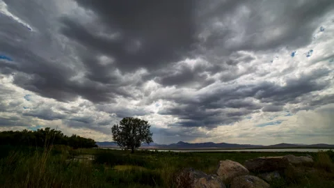 Timelapse of clouds moving through the sky along the shore of Utah Lake Stock Footage 340839325