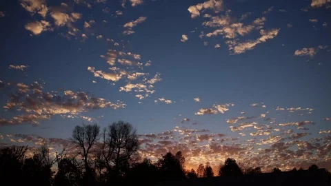 Timelapse of clouds moving toward the camera as the sun sets Stock Footage 91825300