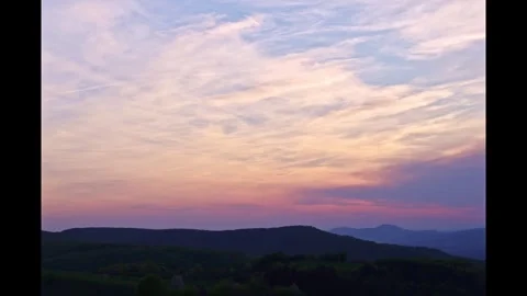 Timelapse of clouds in the orange sky during sunset 스톡 동영상 273692032