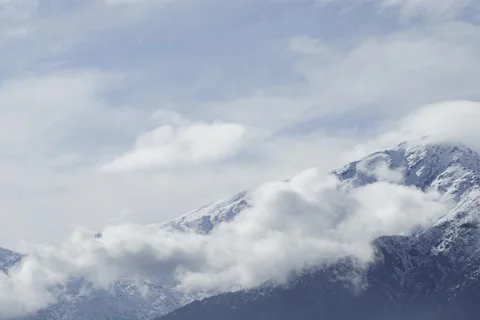 Timelapse of clouds over the Andes Mountains in Santiago, Chile. Stock Footage 345670060