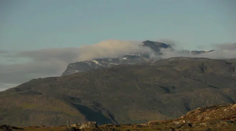Timelapse clouds over barren landscape in Greenland Stock Footage 30311483
