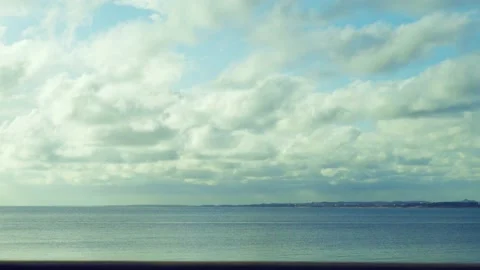 Timelapse of clouds over the blue mediterranean sea Stock Footage 239546043