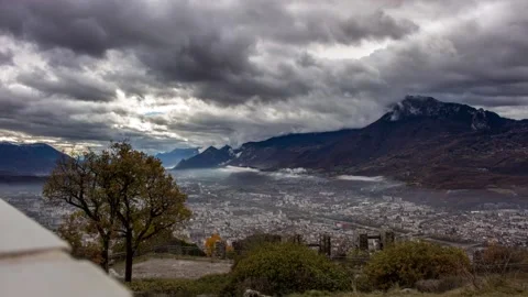Timelapse - clouds over city and valley Stock Footage 165683406