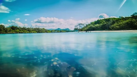 Timelapse Clouds over Clear Blue River Water Stock Footage 139083900