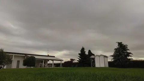 Timelapse Clouds Over the Cottage in the Garden Stock Footage 132340350