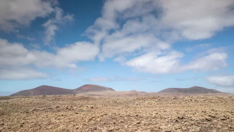 Timelapse of clouds over desert Timanfaya National Park. Stock Footage 140143046
