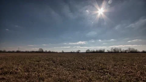 Timelapse clouds over the field. Video stock 61299036