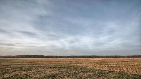 Timelapse clouds over the field. FULL HD, autumn landscape footage. Stock Footage 58484126