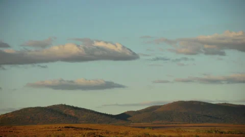 Timelapse of clouds over the Flinders Ranges in the Australian Outback at sunset Stock Footage 29789143