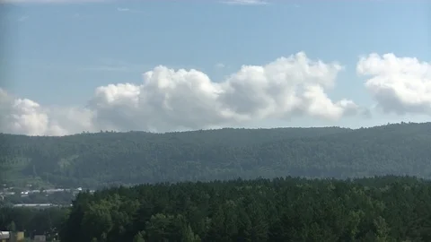 Timelapse clouds over the forest Stock Footage 116587591
