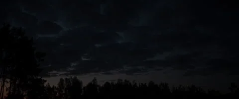 Timelapse of clouds over forest sunset anamorphic Stock Footage 242870762