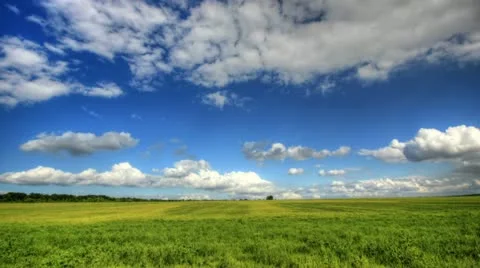 Timelapse clouds over the green field. Stock Footage 11967739