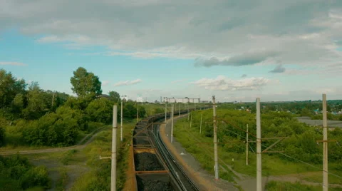 Timelapse clouds over the green field and rail road Stock Footage 56231459